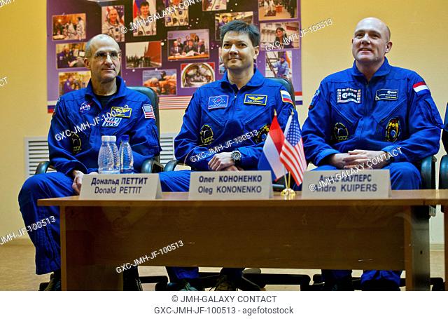 Expedition 30 crew members from left; NASA astronaut and Flight Engineer Don Pettit, Soyuz Commander Oleg Kononenko, and European Space Agency astronaut and...