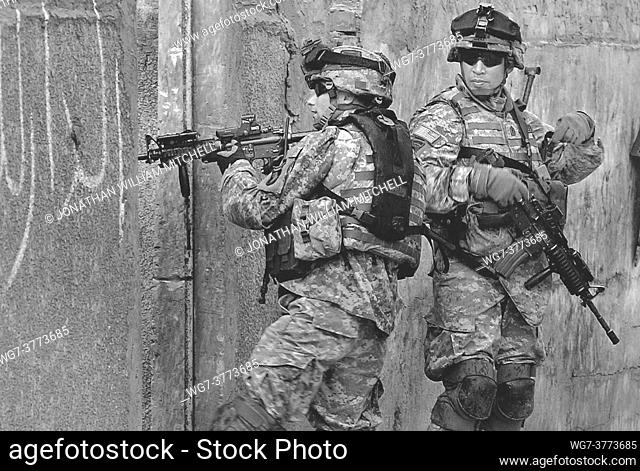 IRAQ Sadr City -- 17 Apr 2006 -- US Army Corporal Jared Jenkins and 1st Sgt Arthur Abiera, Apache Troop, 1st Squadron, 33rd Cavalry Regiment