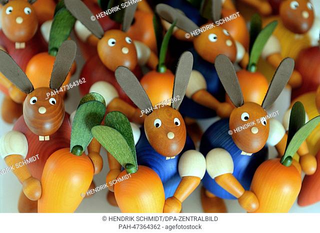 Wooden Easter bunnies and Easter eggs are pictured at the turner's workshop of Torsten Martin in Eppendorf, Germany, 21 March 2014