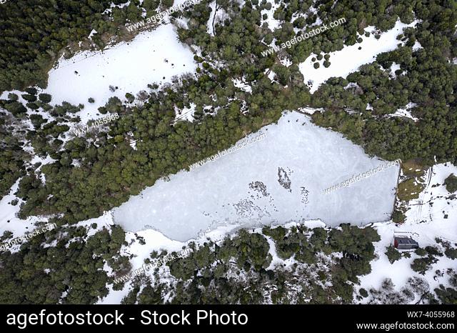 Aerial view of the Bassa d'Oles frozen lake in winter (Aran Valley, Catalonia, Spain, Pyrenees)