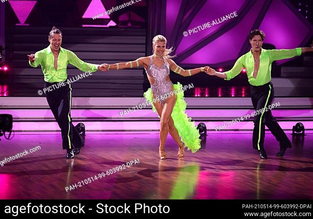 14 May 2021, North Rhine-Westphalia, Cologne: Actress Valentina Pahde and professional dancer Valentin Lusin (l) dance a trio dance together with dancer Evgeny...