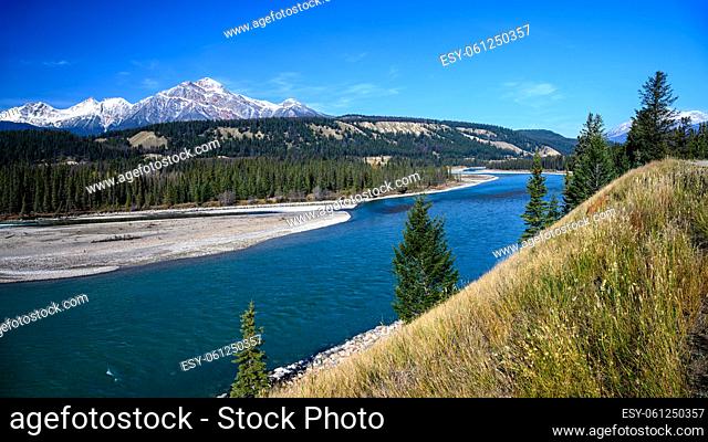 16x9 panoramic format photo of the landscape of the Athabasca River and Pyramid Mountain in the Jasper National Park Alberta, Canada