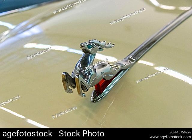 Moscow, Russia - November 10, 2018: The classic emblem of the Volga GAZ M-21 cars - a figure of a running deer on the hood