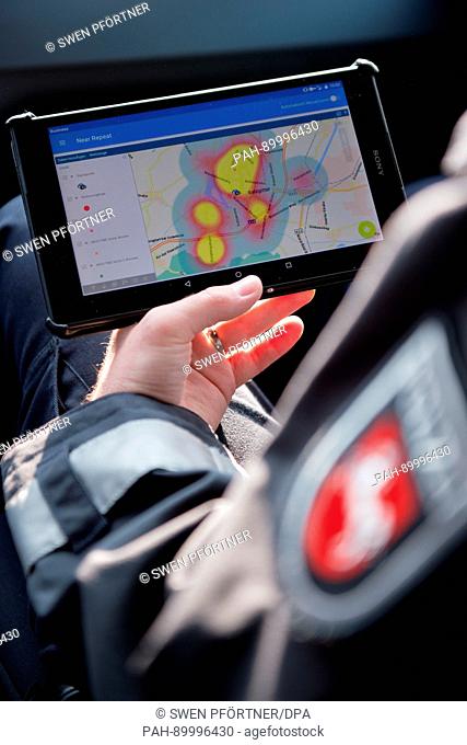 A police commissioner from the Salzgitter-Peine-Wolfenbüttel precinct shows a Tablet PC running ""Premap"", the crime prevention app by the local...