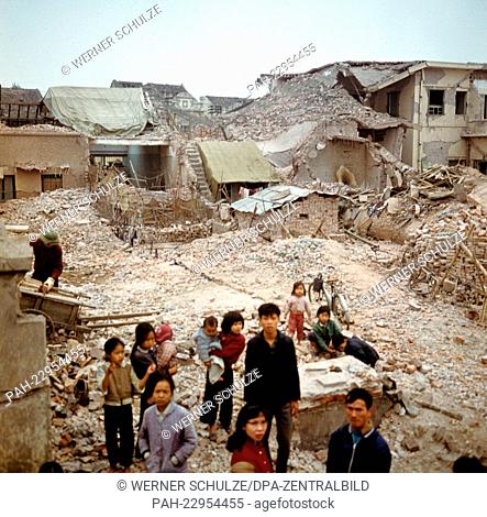 War-destroyed houses, ruins, debris and provisional huts in Kham Thien, a part of Hanoi in North Vietnam in March 1973. The United States of America flew about...