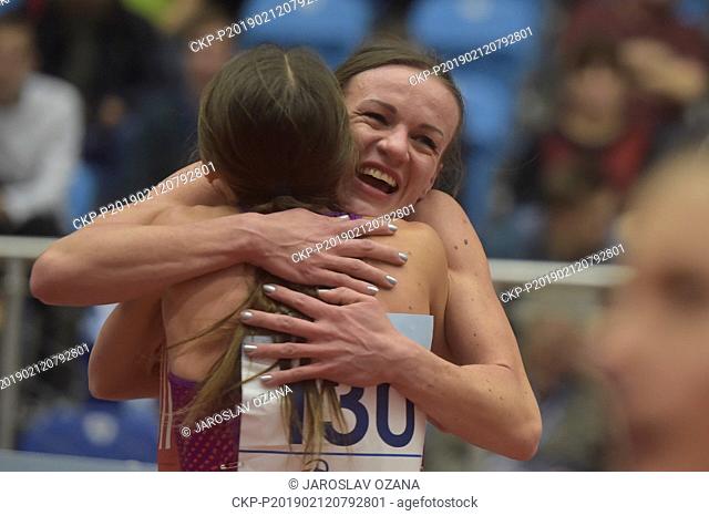 Katarzyna Broniatowska (POL), nr 130, emraces the second placed Simona Vrzalova (CZE) after the women's 1.500 m race within the Czech Indoor Gala