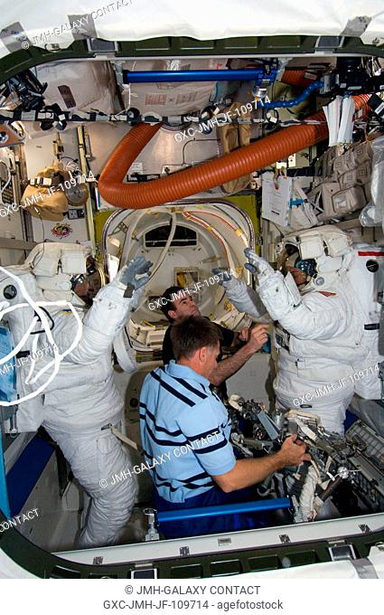Attired in their Extravehicular Mobility Unit (EMU) spacesuits, astronauts Heidemarie Stefanyshyn-Piper (right) and Steve Bowen