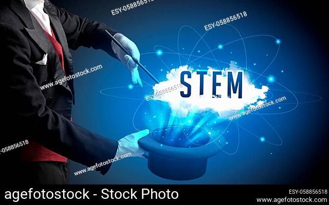 Magician is showing magic trick with STEM abbreviation, modern tech concept