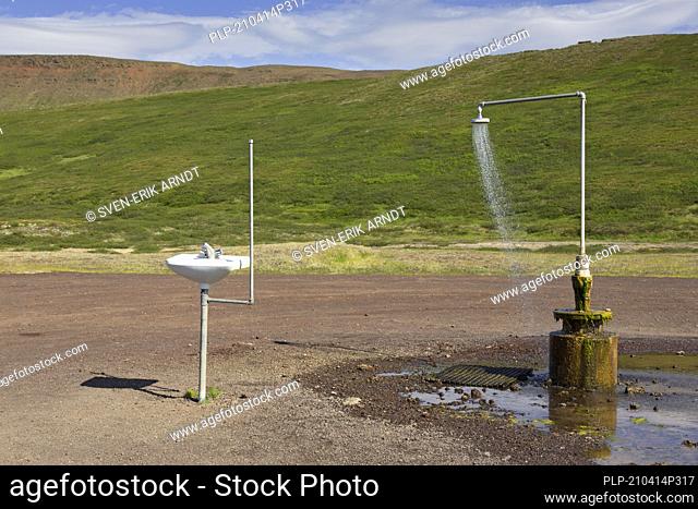 Shower and sink with hot water at Krafla, volcanic caldera in the Myvatn Geothermal Area in summer, North Iceland