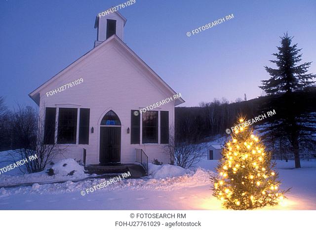 church, chapel, Christmas tree, decorations, holiday, snow, winter, A small evergreen tree in front of the church in the evening in Vershire is decorated with...