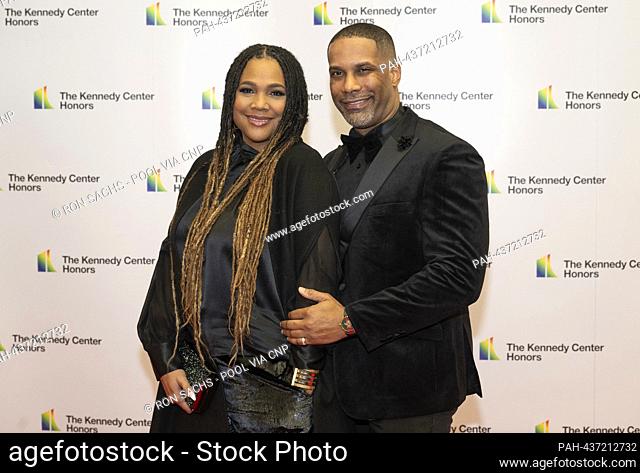 Monie Love and Rezell Simmons, right, arrive for the Medallion Ceremony honoring the recipients of the 46th Annual Kennedy Center Honors at the Department of...
