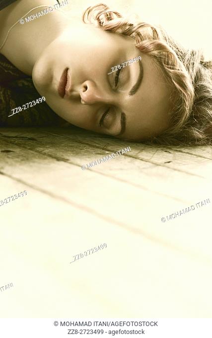 Portrait of a woman laying on the floor