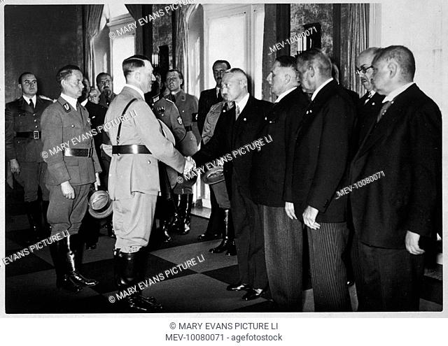 The Fuhrer inspects Dusseldorf. The 'Schaffen des Volks' celebration, with left, Gauleiter Florian