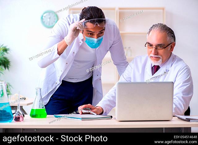 The two chemists working in the lab