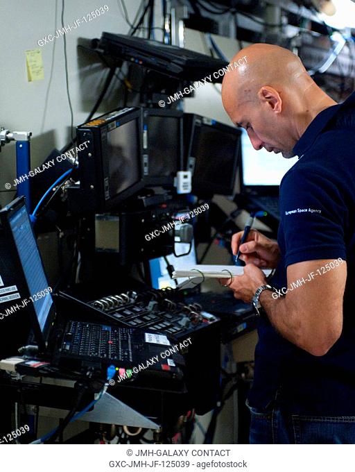 European Space Agency astronaut Luca Parmitano, Expedition 3637 flight engineer, participates in an electrical power system training session in the Space...