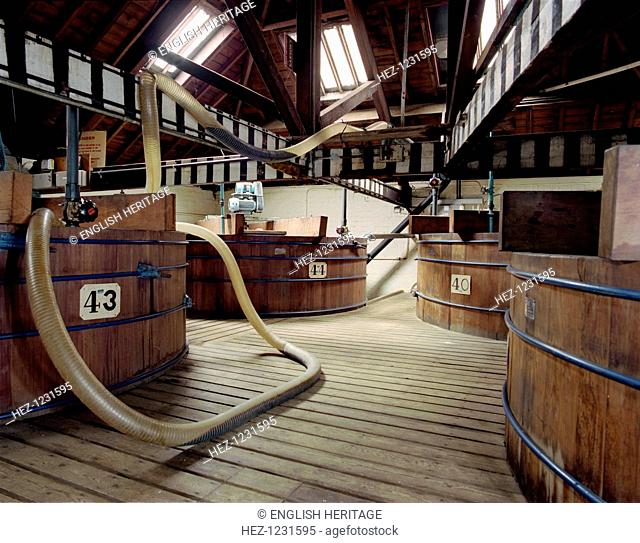 Vats at Sarsons Vinegar Factory, Severn Street, Stourport, Worcestershire, 2000. The large wooden vats are shown on a tidy, clean and ordered factory floor