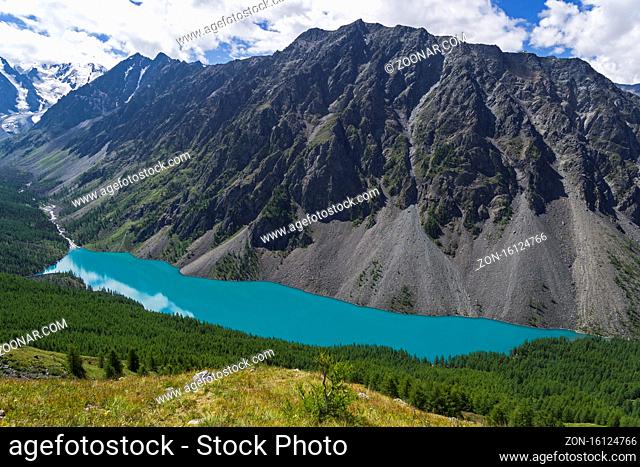 Aerial view of Shavlo Lake. At the end of the valley three peaks of the North-Chuisky ridge can be seen: Dream, Fairy Tale and Beauty (Mechta