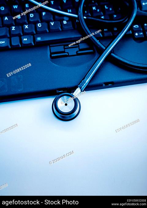 Electronic medical, stethoscope on PC/Laptop/Keyboard? blue toned images