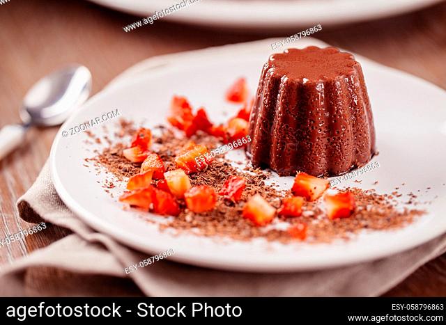 Chocolate pudding with fresh strawberries on a plate