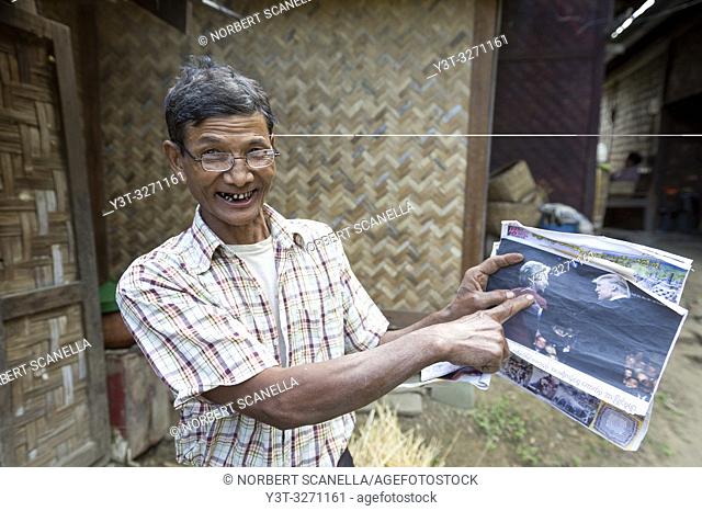 Myanmar (ex Birmanie). Sagaing, region of Mandalay. Rural village. A villager shows the photo of Donald Trump and Hillary Clinton during the US presidential...