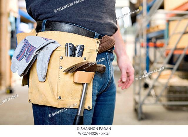 Workman with toolbelt