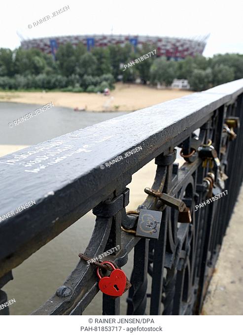 Locks that are attached to bridges as 'lovelocks' according to custom hang near the national stadium on the banks of the Vistula River in Warsaw, Poland