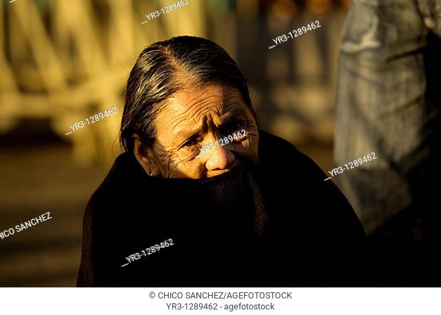 An elderly indigenous pilgrim sits at the entrance of the Our Lady of Guadalupe Basilica in Mexico City, December 8, 2010  Hundreds of thousands of Mexican...