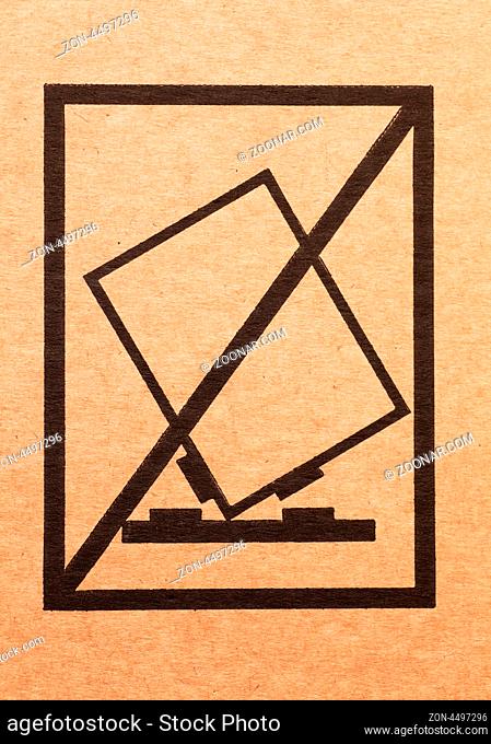 Handle with care sign on a cardboard box