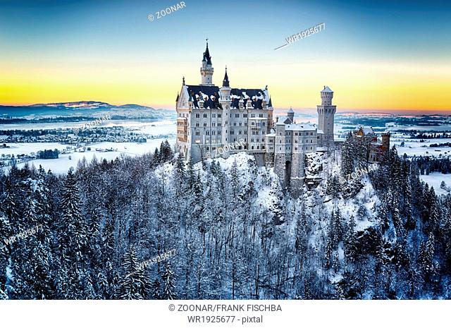 Neuschwanstein Castle at sunset in winter landscap