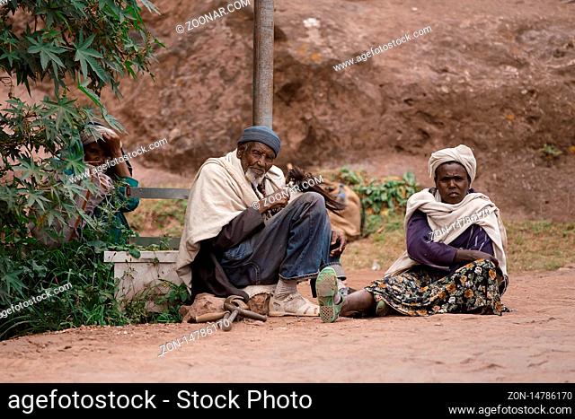 LALIBELA, ETHIOPIA, MAY 1st. 2019, Orthodox Christian Ethiopian people relaxing after mass in front of famous rock-hewn St