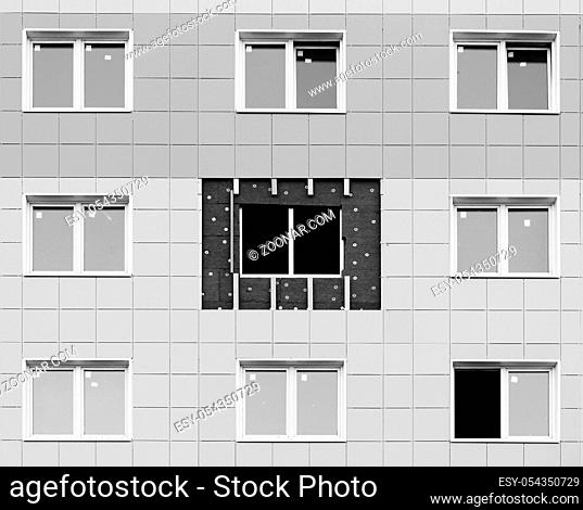 black and white photo windows in a newly built house. wall structure with insulated non-combustible material basalt fiber tiled