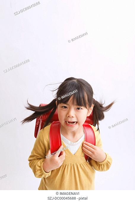 Girl carrying school bag