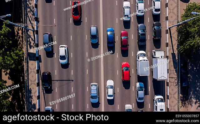 Aerial view of the vehicular intersection, traffic at peak hour with cars on the road