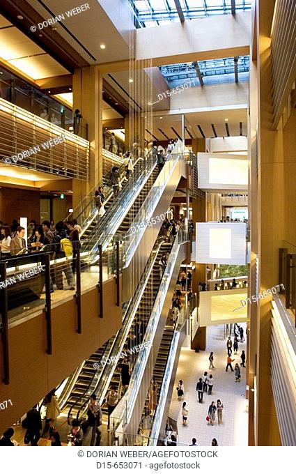 The newly opened Tokyo Midtown in Roppongi. Escalators connecting the 4 Levels of the Galleria, an open Foyer Arcade with modern shops, cafes and restaurants