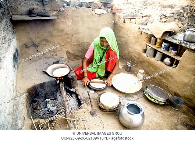 Indian Rural Woman Making Chapaati Bread, Village Delwara, Udaipur, Rajasthan, India