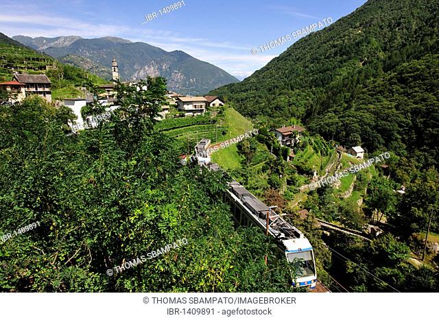 Centovalli valley with the town of Intragna and a train heading to Domodossola, Canton of Ticino, Switzerland, Europe