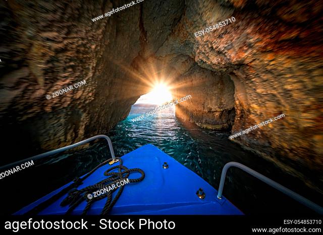 Front of a blue tourist boat sailing inside the Blue Caves, Zante Island, Greece