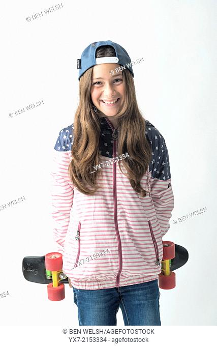 Happy girl with a skateboard