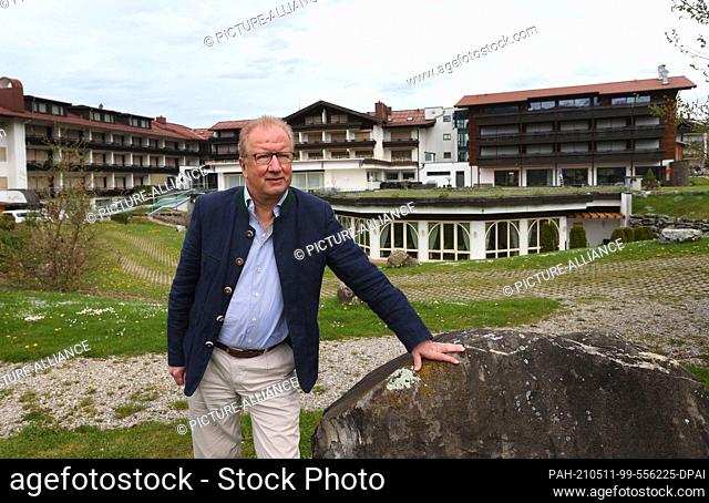 11 May 2021, Bavaria, Oberstdorf: Karl-Arnold Schüle, hotelier, stands in front of his hotel. Whitsun holiday in Bavaria? Yes