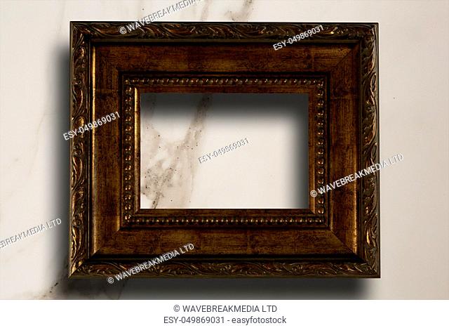 Empty photo frame against modern marble surface