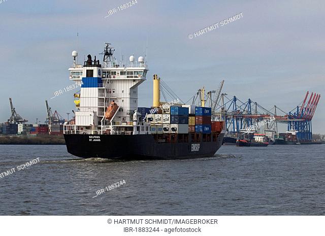 Container ship Selfoss, leaving the port of Hamburg, behind cranes and gantry cranes, Elbe river, Hamburg, Germany, Europe