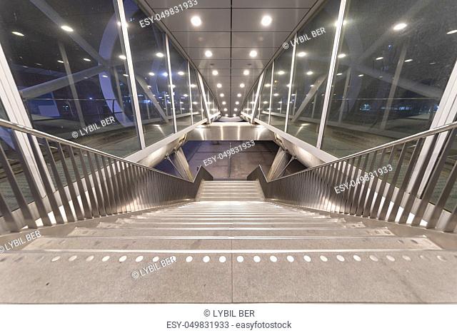 Beatrixkwartier (Beatrix district in Dutch) entrance East escalator getting out from tramway station in The Hague at night, Netherlands