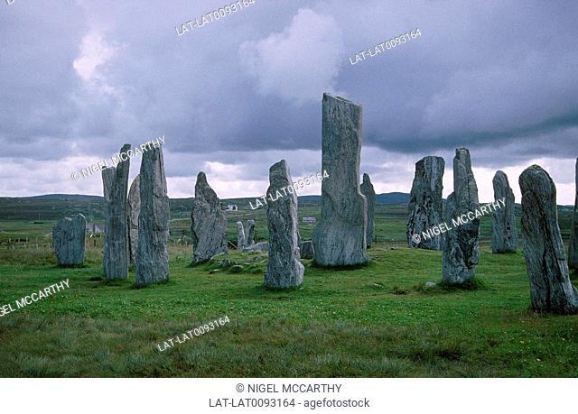 Ancient standing stones in circles. Tall stones on end in ground