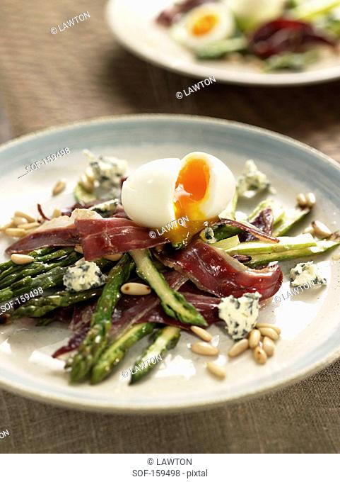 Fried wild asparagus and duck ham, soft-boiled egg and pine nuts