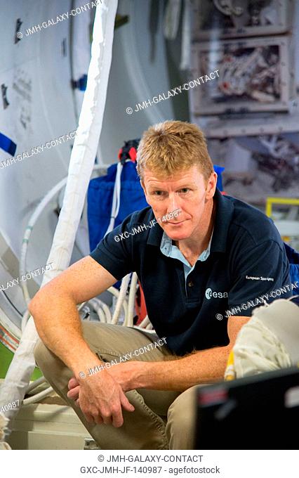 European Space Agency astronaut Timothy Peake, Expedition 4647 flight engineer, is pictured during a space station EVA planning and preparation session in an...