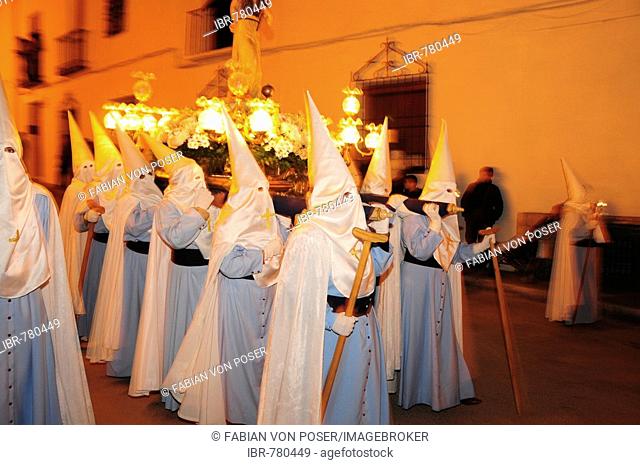 Penitents wearing penitential robes (nazareno), Holy Week procession, Semana Santa, Belmonte, Castilla-La Mancha region, Spain