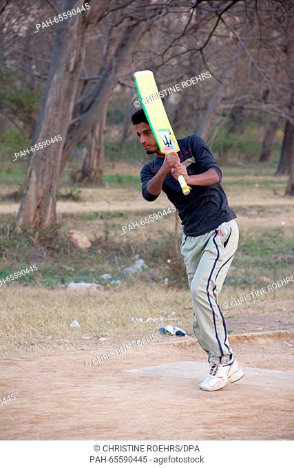 A young Pakistani batsman plays a short during an evening practice session of street cricket in a park in Islamabad, Pakistan, 03 February 2016