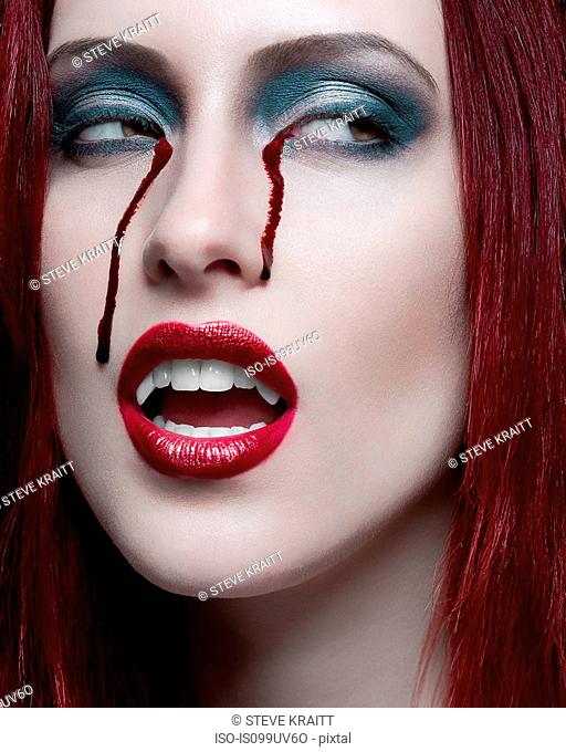 Portrait of young woman with eyes bleeding