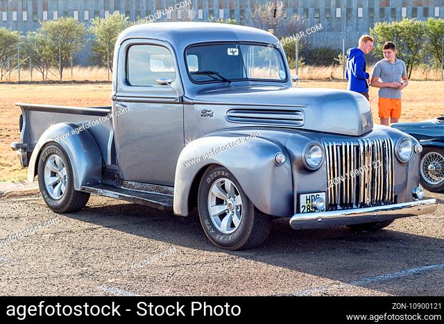 QUEENSTOWN, SOUTH AFRICA - 17 June 2017: Vintage F series silver grey Ford pick up truck hot rod parked on display at public show