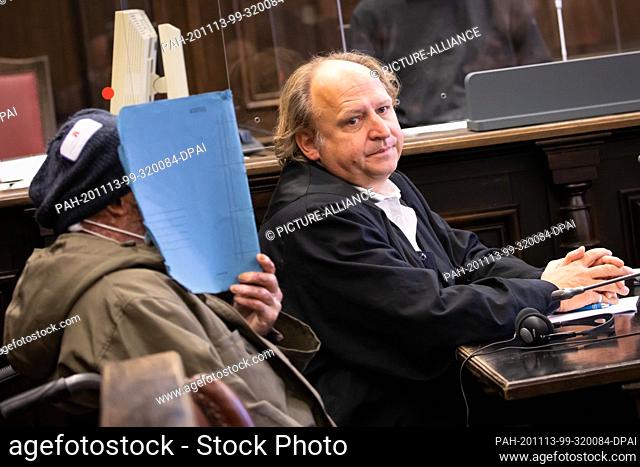 13 November 2020, Hamburg: The accused and his lawyer Tim Burkert (r) sit in the courtroom in the criminal justice building at the beginning of the trial